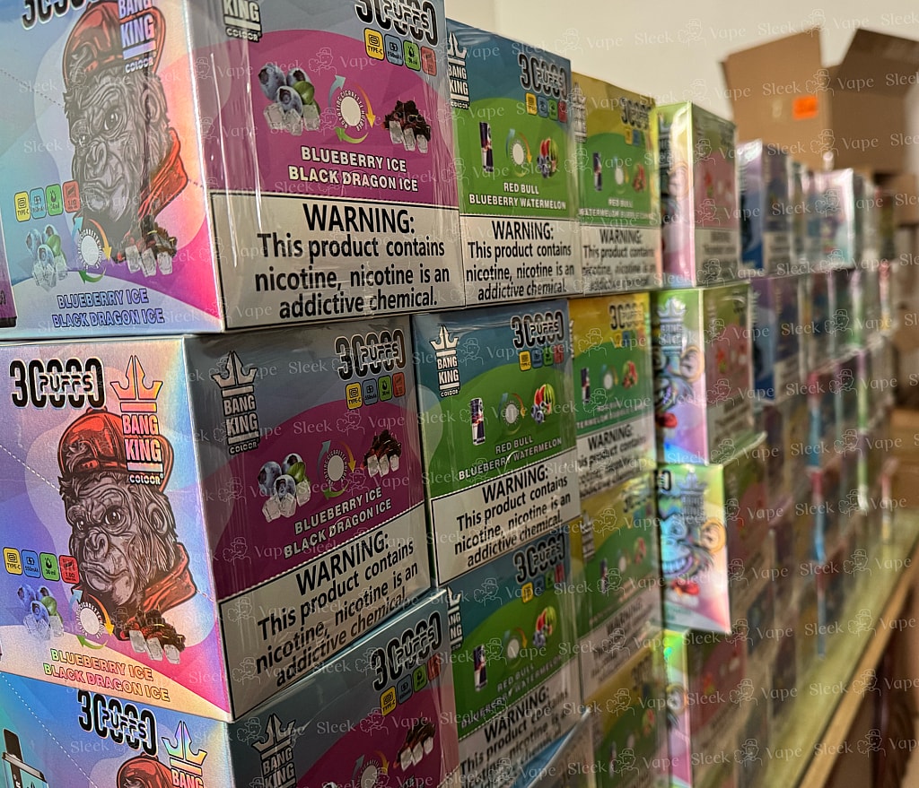 Bang 30000 30k Puffs sleekvape warehouse stock - 2 - SleekVape Stacks of boxed Bang King disposable vapes in various flavors, with prominent nicotine warning labels visible on the packaging.