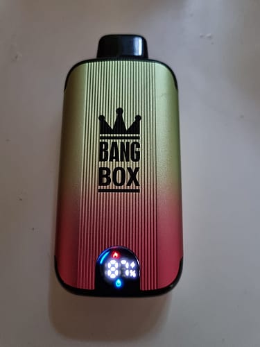 A Bang Box vape device displaying a digital screen with an 87% battery indicator.