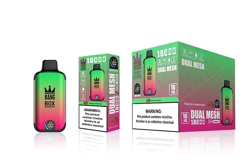 Image de l'emballage du produit de vapotage "Bang Box" dans un design dégradé vert, rose et noir avec un logo en forme de couronne. La boîte indique "18 CUFFS", "Dual Mesh", "Type-C", "850mAh" et le parfum "Raspberry Watermelon". Une grande étiquette d'avertissement sur la nicotine se trouve en bas.