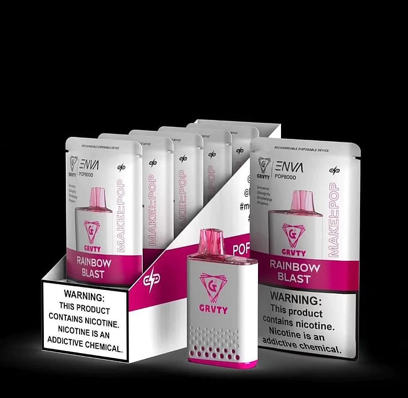 A display of ENVI GRVTY POP8000 rechargeable disposable vaping devices in "Rainbow Blast" flavor, featuring a warning label about nicotine addiction.