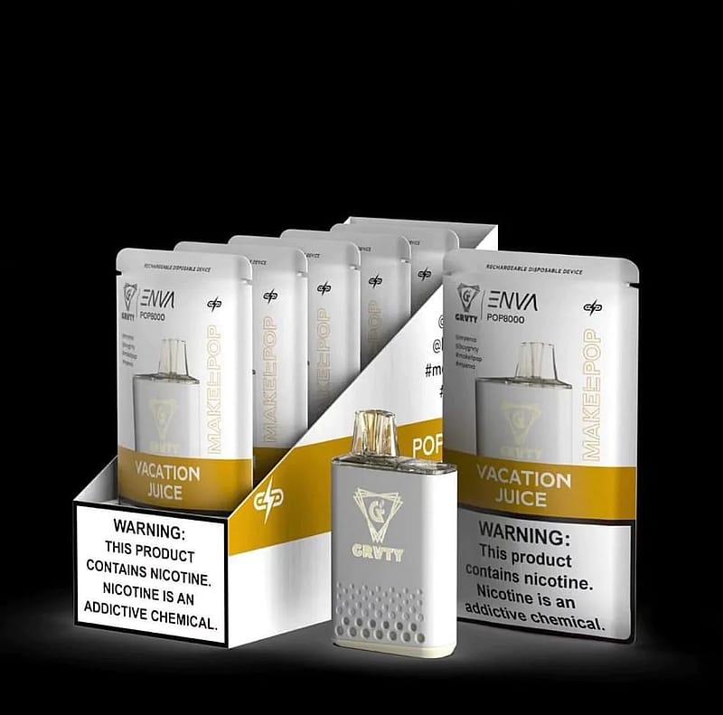 A display of GRVTY branded vape products labeled "Vacation Juice," featuring a rechargeable disposable device with nicotine warning.