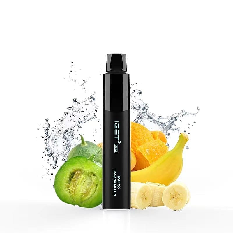 A sleek black vape device labeled "IGET" with "Mango Banana Melon" flavor, surrounded by splashes of water, banana slices, mango chunks, and melon slices.