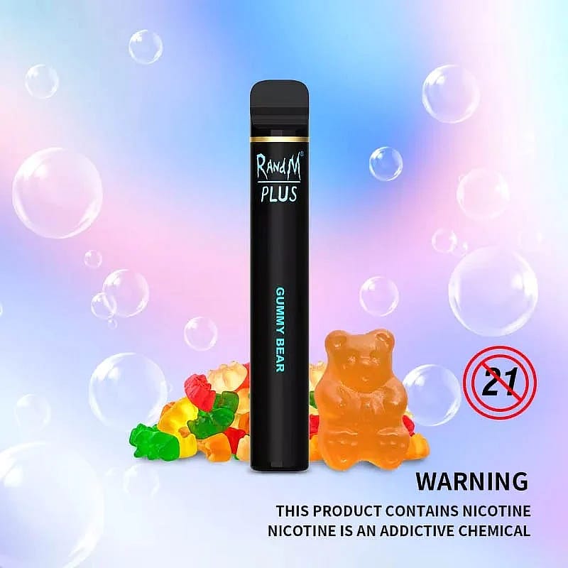 Dispositivo de vapeo desechable con la etiqueta "RandM Plus" y sabor a "Gummy Bear", sobre un fondo pastel con ositos de goma y burbujas. El texto de advertencia indica el contenido de nicotina y la restricción de edad para mayores de 21 años.