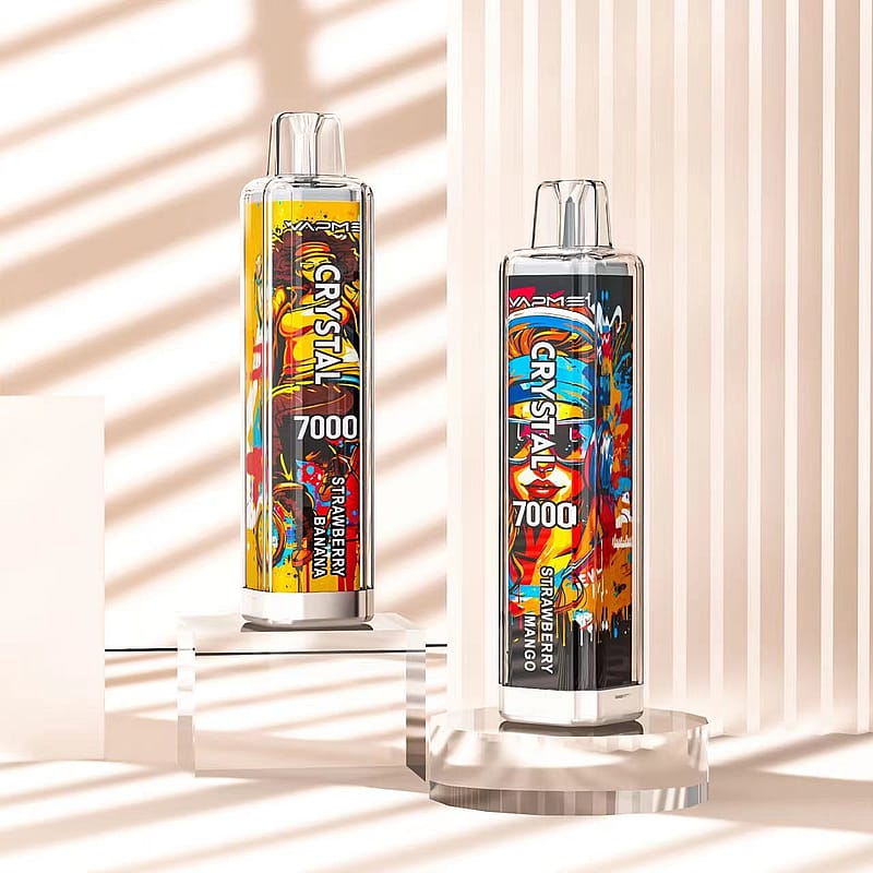Two colorful vape devices labeled "CRYSTAL 7000" with flavors "Strawberry Banana" and "Strawberry Mango" are displayed on clear stands against a beige striped background.