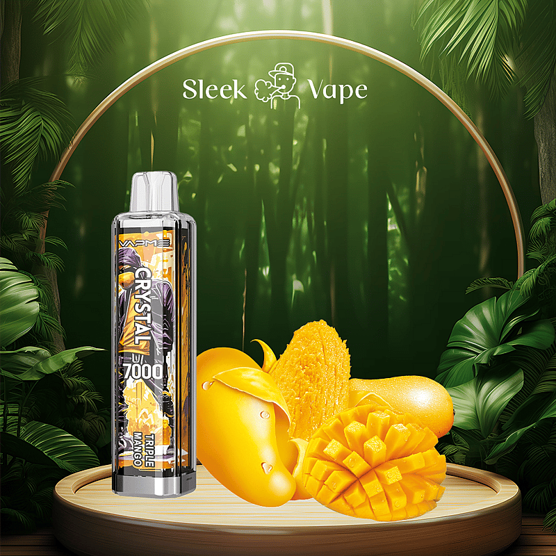 A sleek vape device labeled "CRYSTAL 7000 Triple Mango" is displayed next to fresh, ripe mango slices on a wooden platform with a lush, green jungle background.