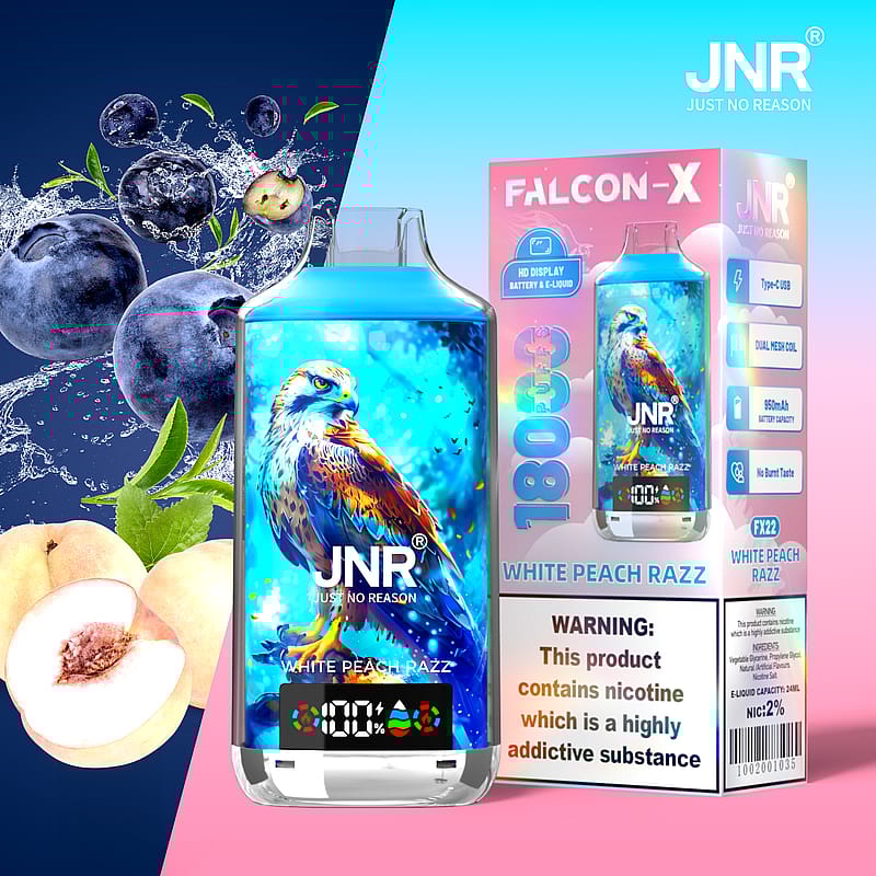 Dispositivo de vapeo Falcon-X de JNR con ilustración de un halcón, etiquetado como "White Peach Razz", con arándanos y melocotones. Etiqueta de advertencia sobre adicción a la nicotina visible en el empaque.