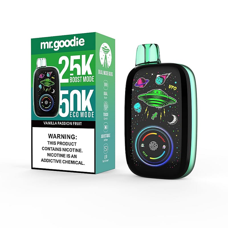 Un appareil de vapotage Mr. Goodie et son emballage sont exposés, avec des graphismes colorés sur le thème de l'espace, notamment un OVNI vert, des planètes et des étoiles, avec un texte soulignant les capacités de double mode de l'appareil (mode Boost 25K, mode Eco 50K) et un avertissement sur la nature addictive de la nicotine.