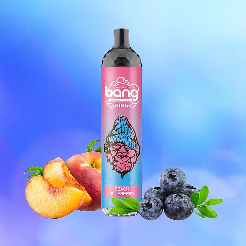 Disposable vape with "Bang" branding in front of peach and blueberry fruits, labeled "Peach Blueberry" flavor.