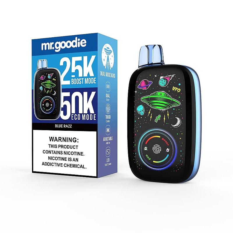Un dispositivo de vapeo metálico con un diseño de temática espacial que incluye ovnis y planetas, exhibido junto a su caja etiquetada como 'mr.goodie' con sabor 'Blue Razz' y modos etiquetados como 25K Boost y 50K Eco, incluida una advertencia sobre nicotina.