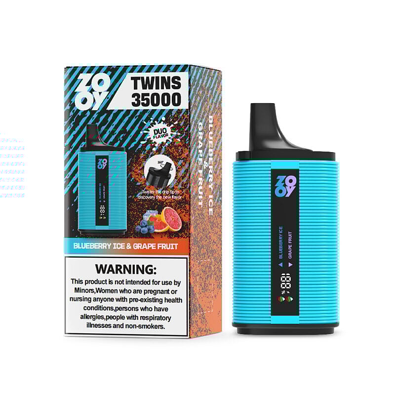 Un dispositivo de vapeo electrónico azul junto a su empaque, que muestra la marca "Zoooy Twins", opciones de sabor "Blueberry Ice & Grape Fruit" y una advertencia de salud sobre su uso.
