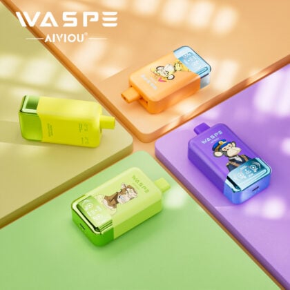 Four colorful electronic devices are arranged on pastel-colored surfaces. The devices feature playful designs, including animal characters, in shades of green, orange, purple, and yellow.