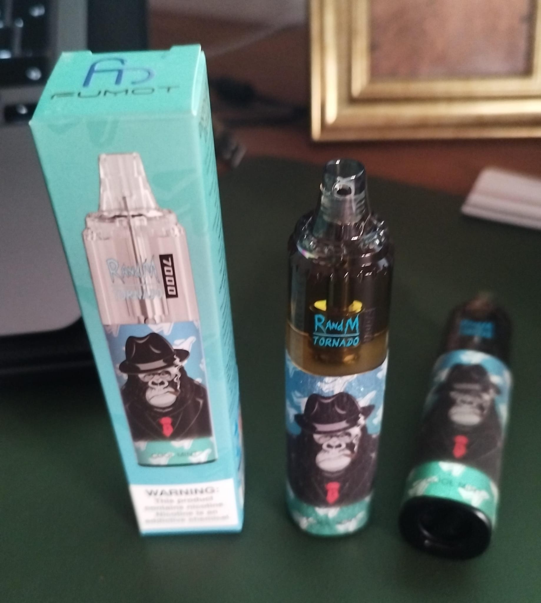 Disposable vape device with a gorilla wearing a hat and tie on the packaging, labeled "RandM Tornado 7000."